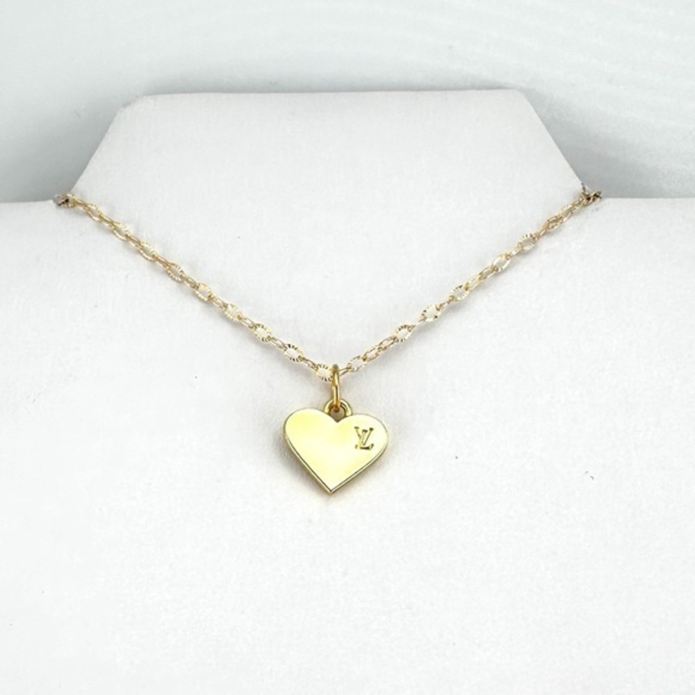 AUTHENTIC Louis Vuitton charm with bonus gift.
